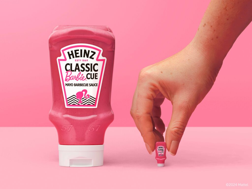 Heinz Classic Barbiecue Sauce and mini version held by hand