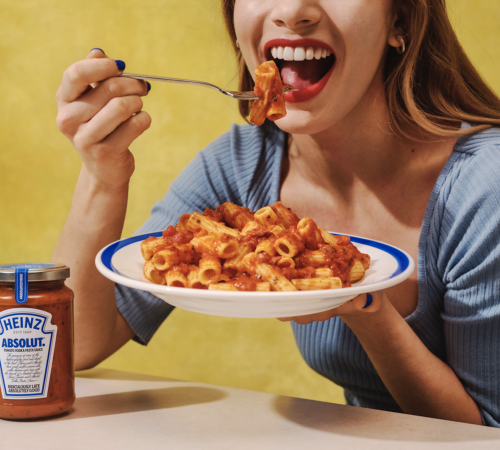 Woman eating Heinz Absolut Tomato Vodka Pasta Sauce