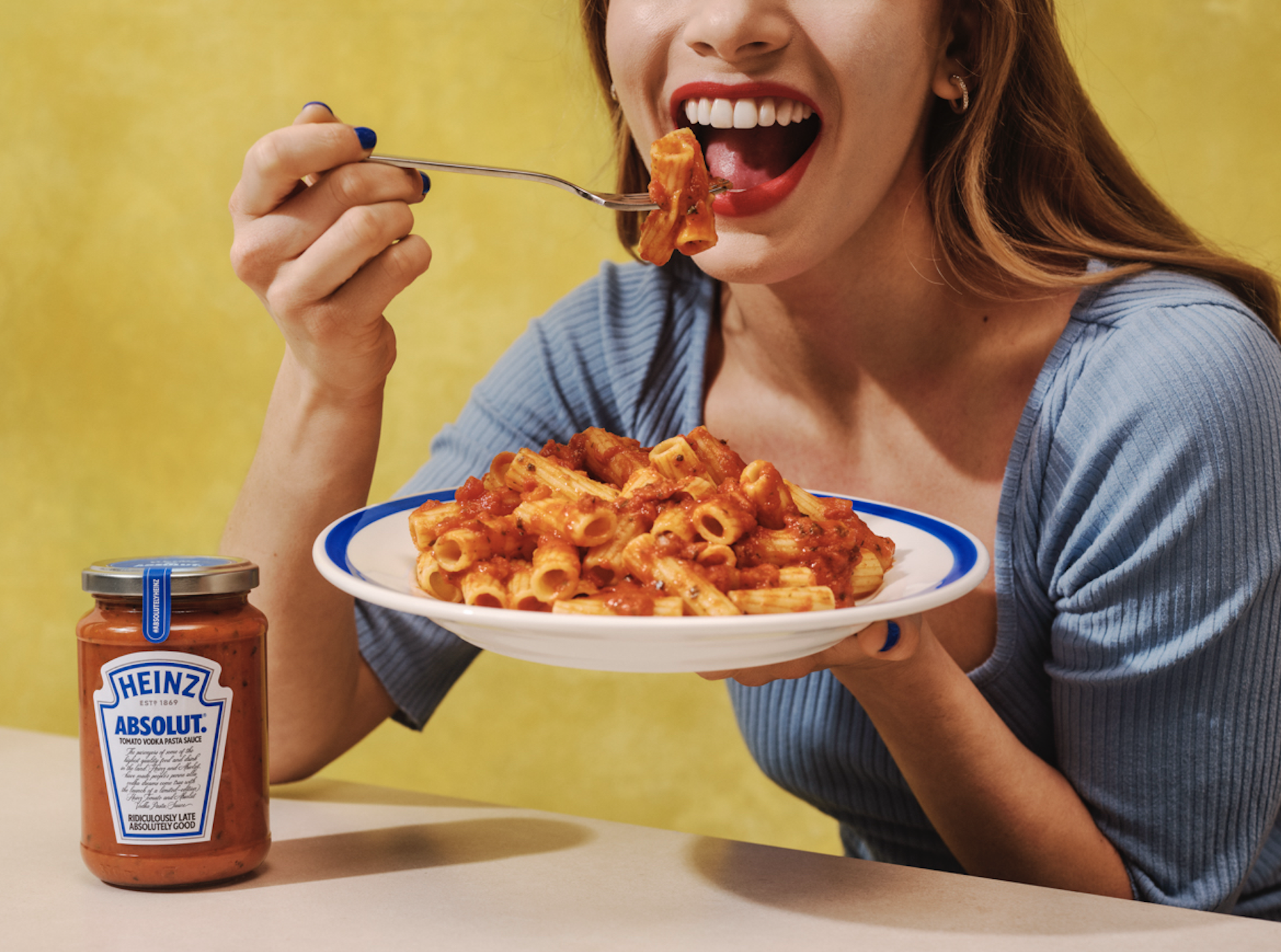 Woman eating Heinz Absolut Tomato Vodka Pasta Sauce