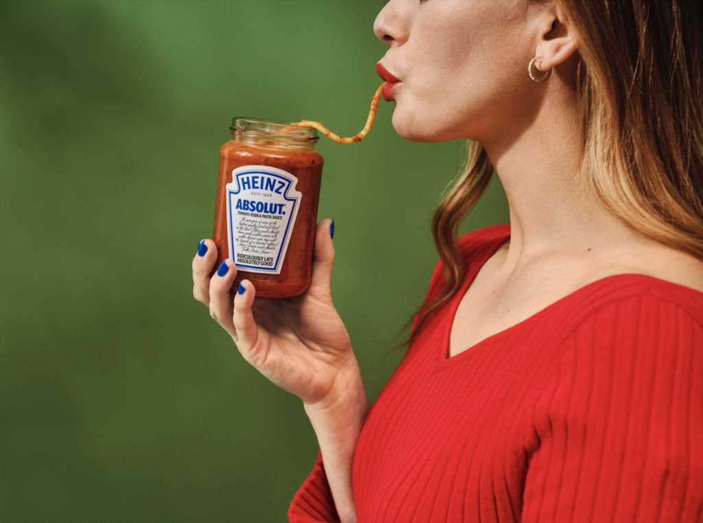 Woman eating Heinz x Absolut Tomato Vodka Pasta Sauce